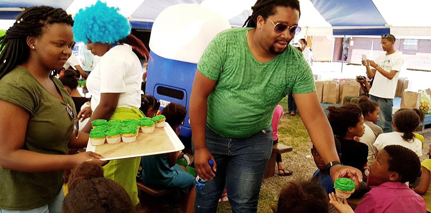GIPTN staff handing out cupcakes