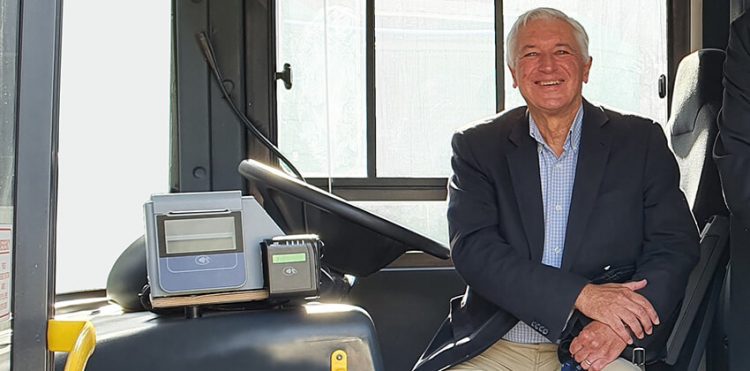 George Mayor Leon van Wyk smiling while sitting at the drivers seat of a GO GEORGE bus