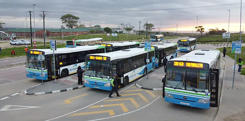 Eight GO GEORGE buses standing at a terminal.